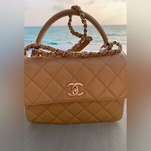 Authentic limited edition , rare nude larger Chanel purse with handle /stripe.